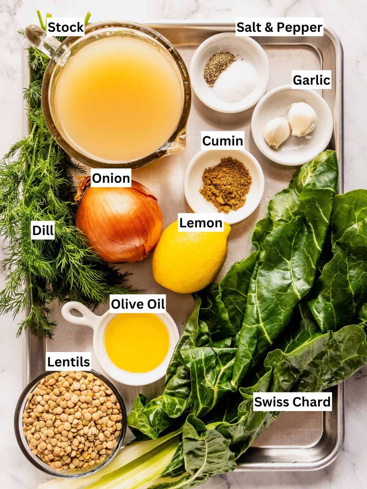 Lentil soup with Swiss chard and lemon recipe ingredients with individual labels on a metal tray.