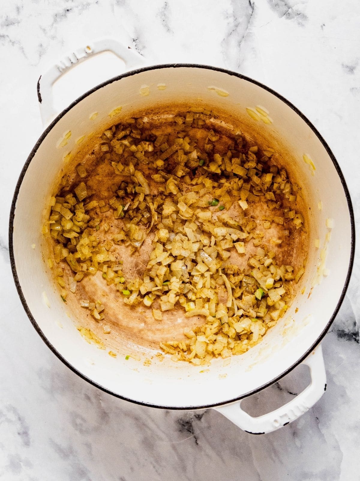 Soup pot with sauteed onion, garlic and spices.