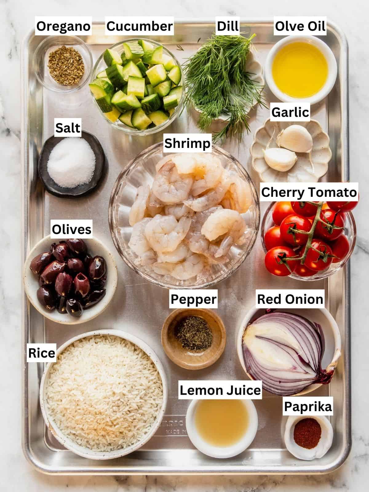 Mediterranean shrimp rice bowl recipe ingredients with individual labels on a metal tray.