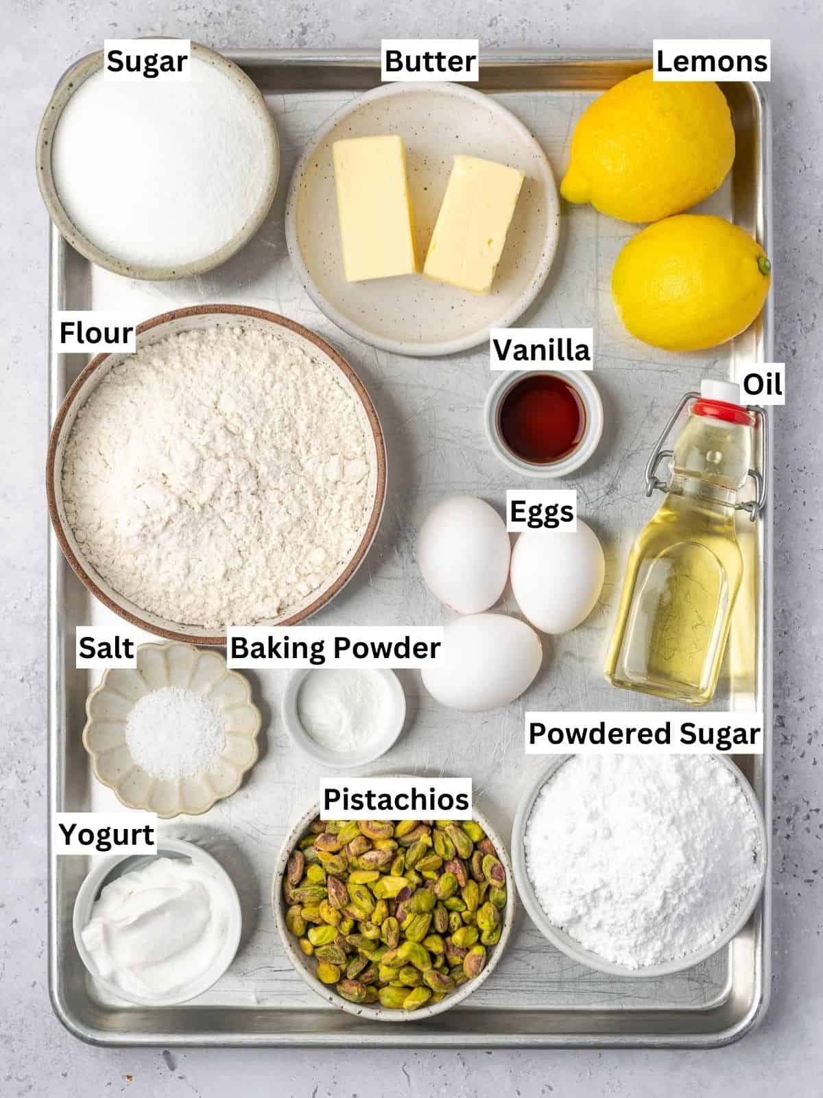 Lemon Pistachio Pound Cake recipe ingredients with individual labels on a metal tray.