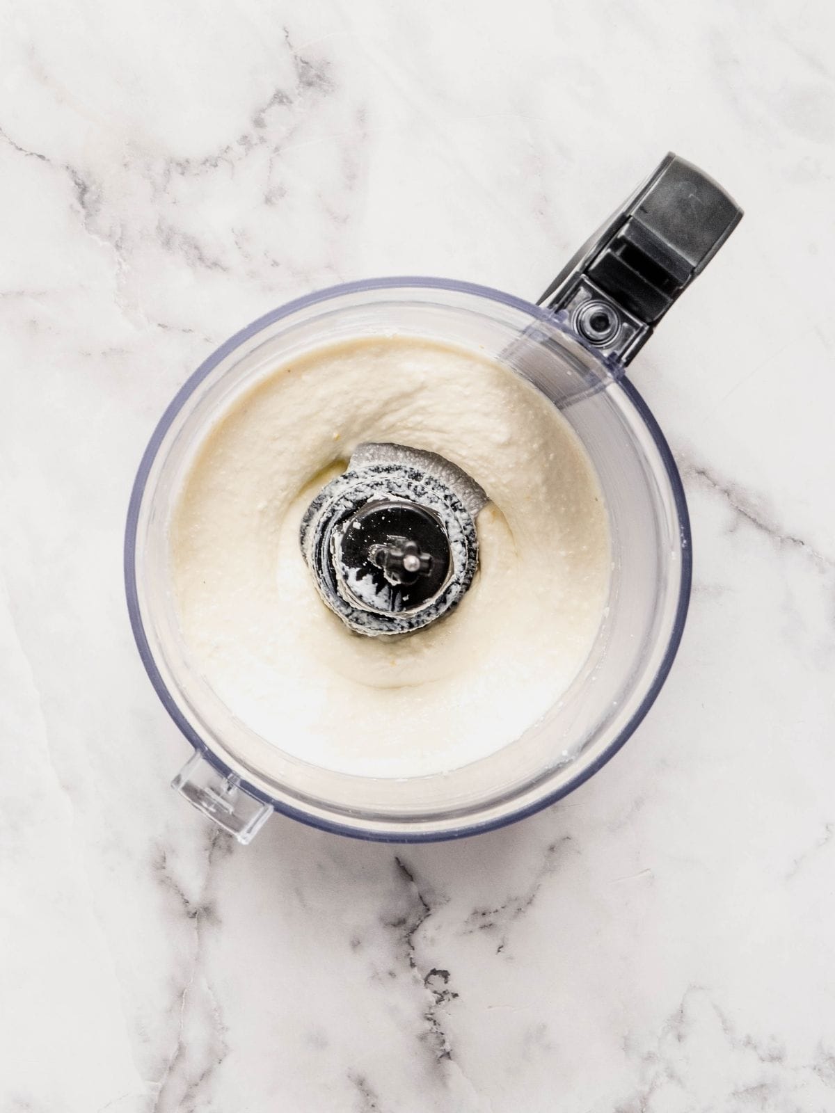 Whipped feta spread in a food processor.