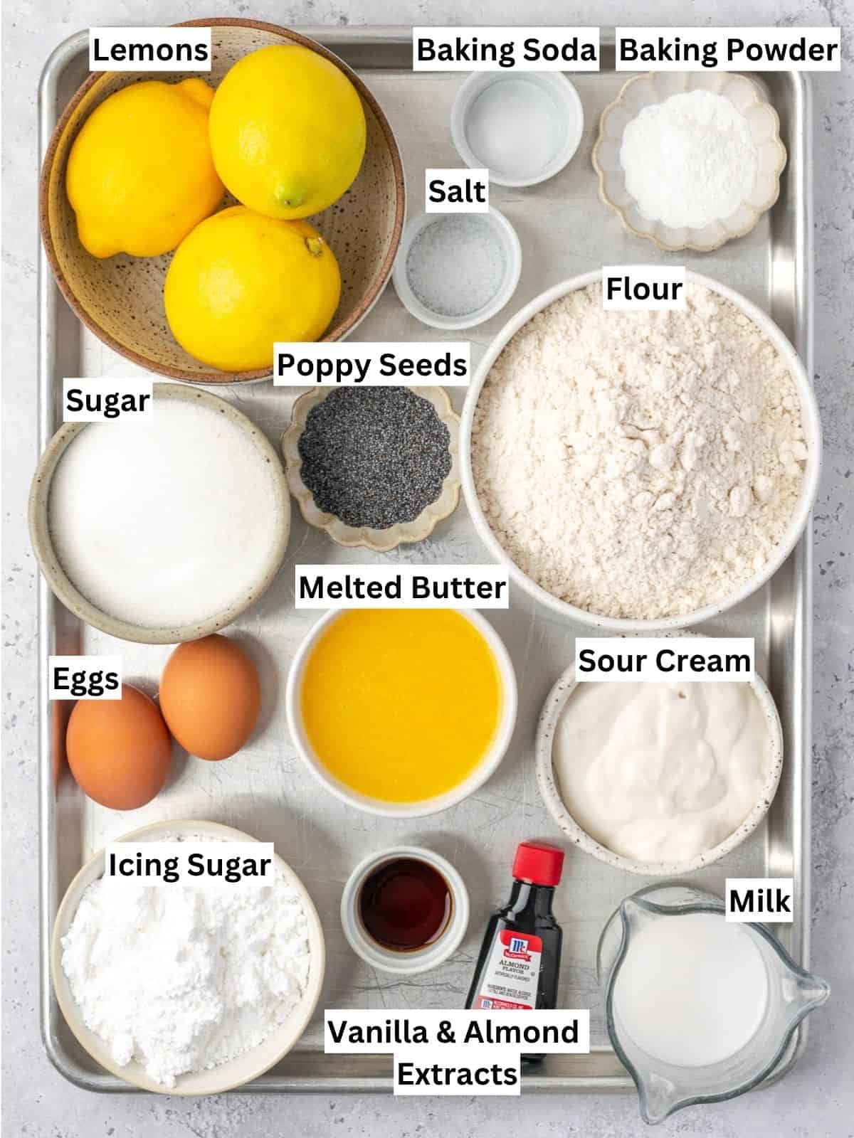 Lemon Poppy Seed Muffins recipe ingredients with individual labels on a metal tray.