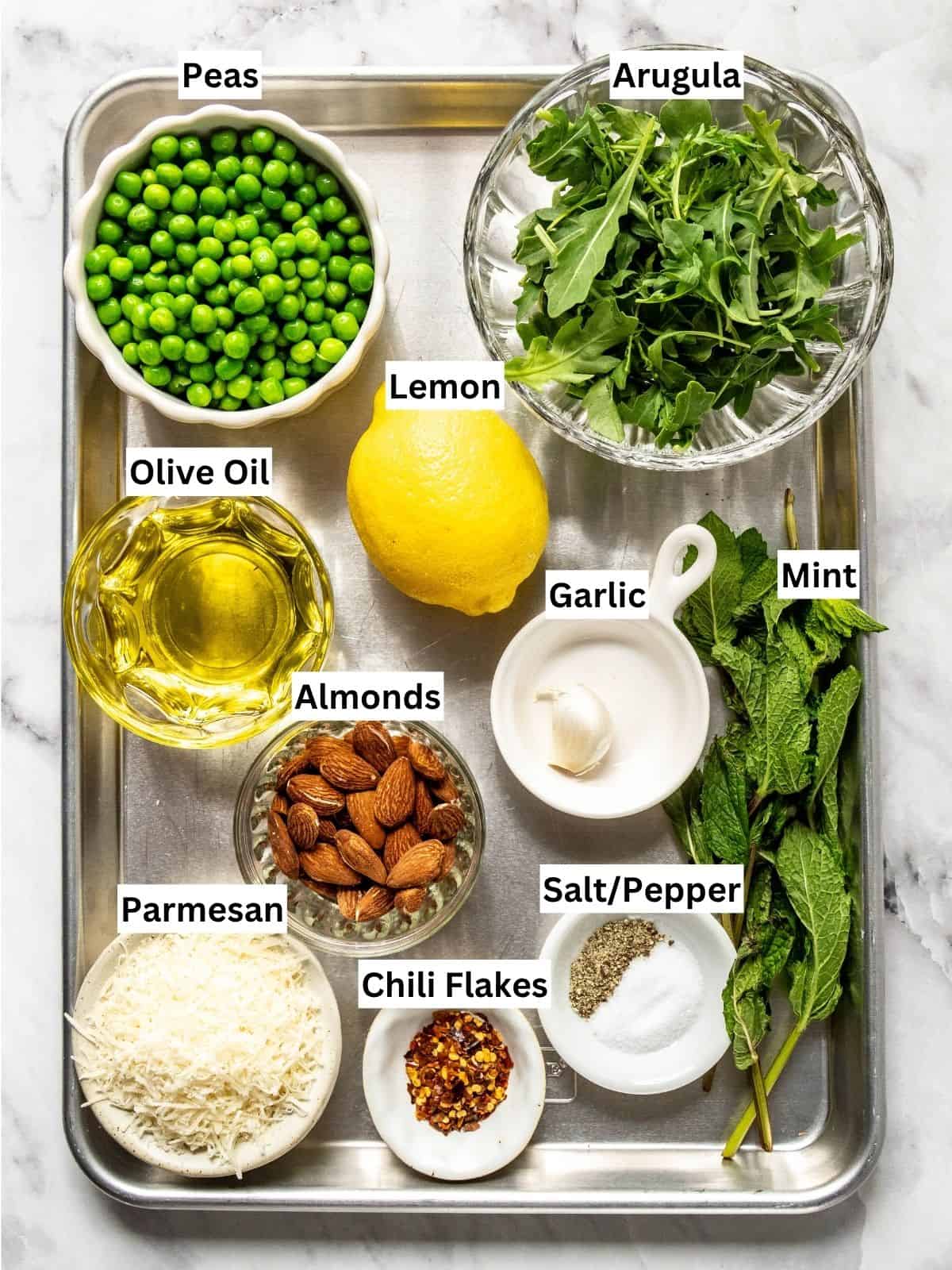 Pea Pesto recipe ingredients with individual labels on a metal tray.