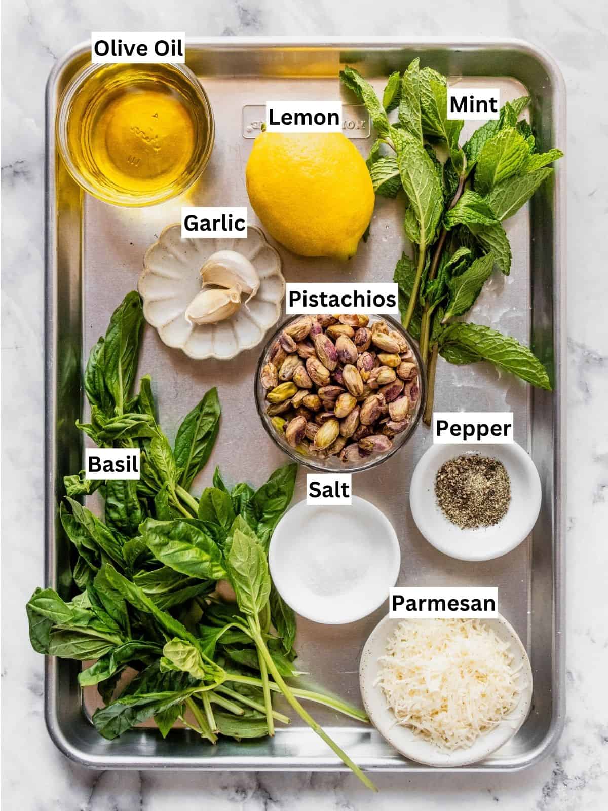 Pistachio Pesto Recipe ingredients with individual labels on a metal tray.
