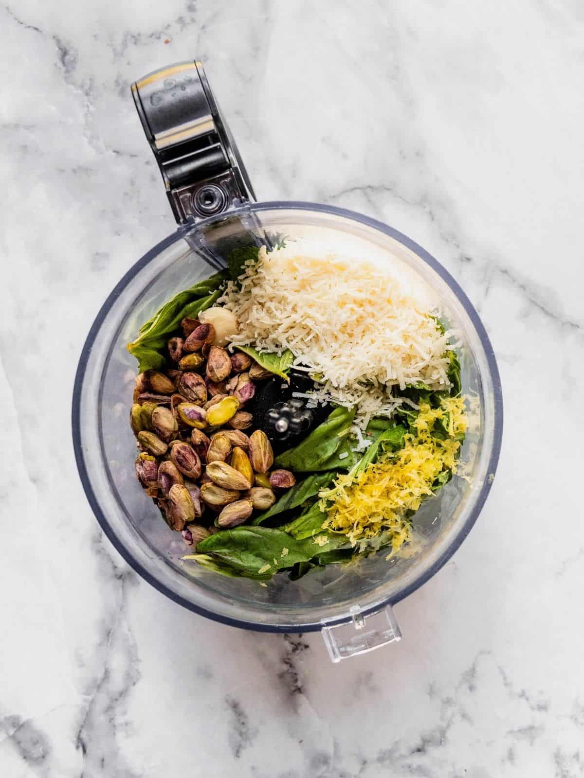 Pistachios, parmesan, basil, garlic, lemon zest and juice in a food processor.