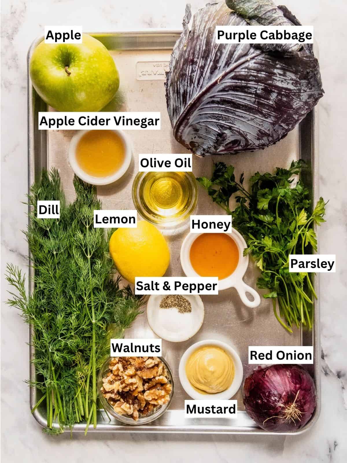 Purple Cabbage Slaw recipe ingredients with individual labels on a metal tray.