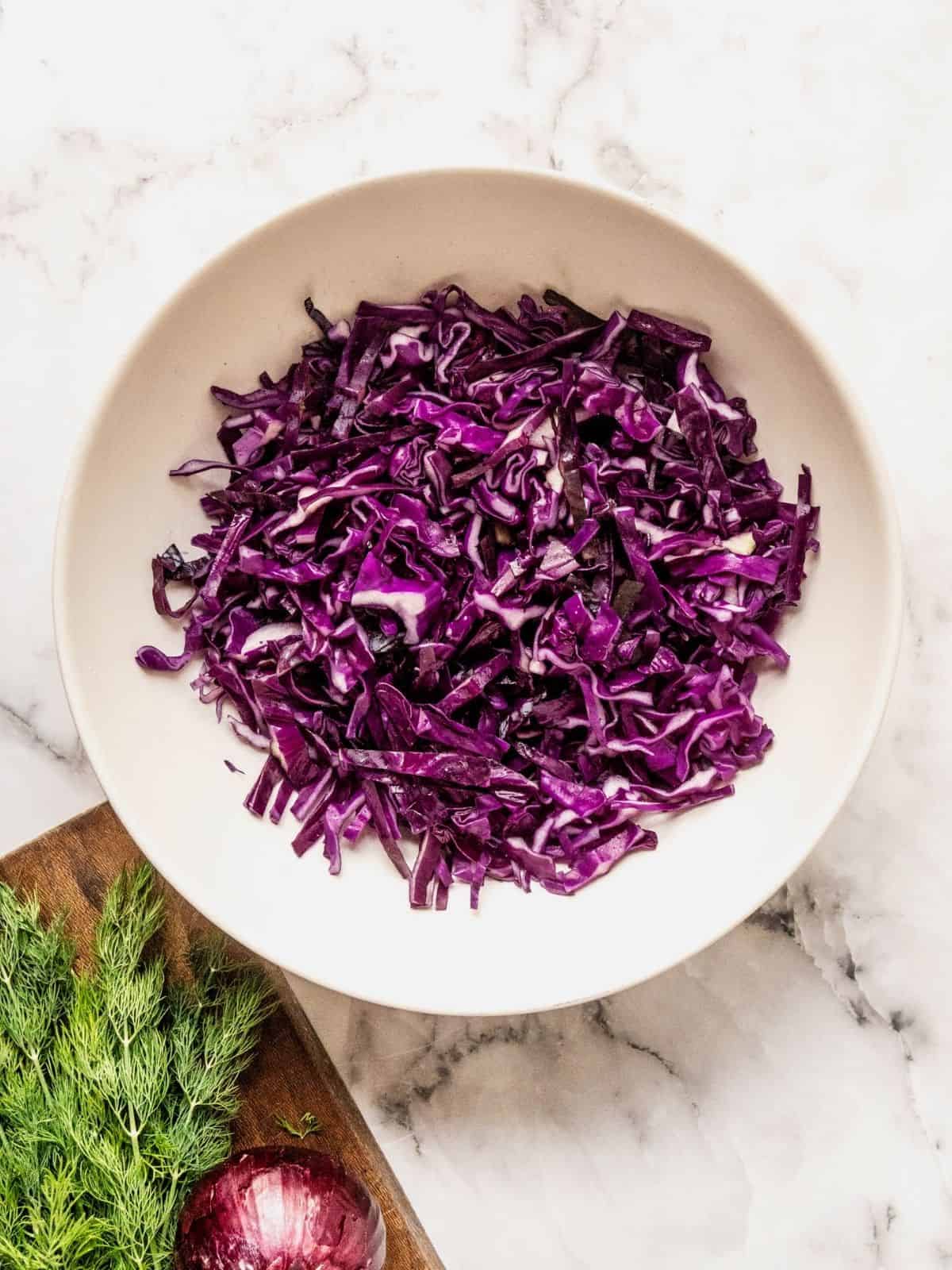 Shredded purple cabbage in a bowl.
