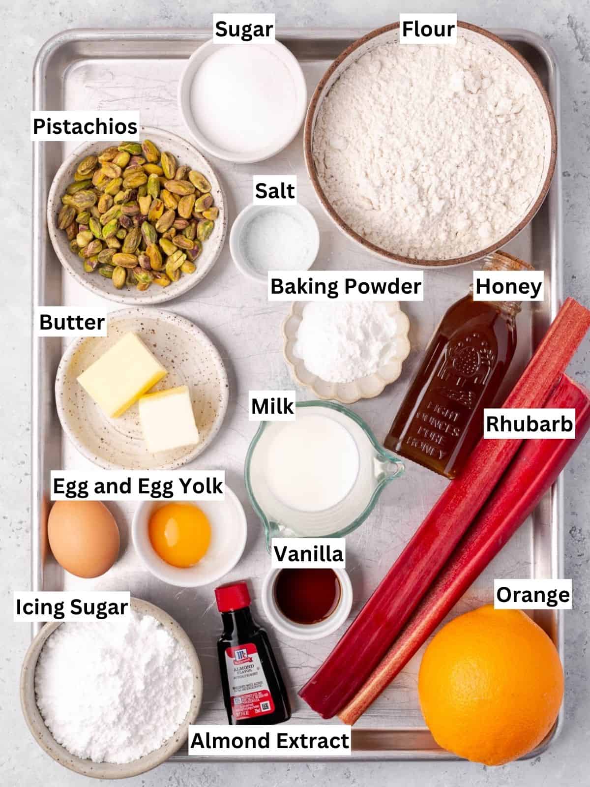 Rhubarb Scones with Orange and Pistachios recipe ingredients with individual labels on a metal tray.