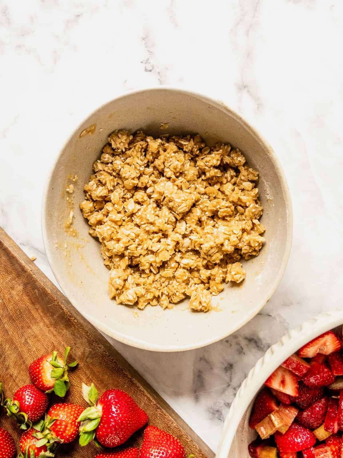 Crisp topping is being prepared in a bowl.