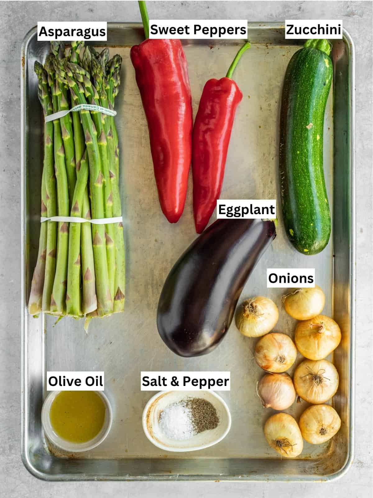 Grilled vegetables recipe ingredients with individual labels on a metal tray.