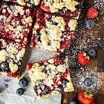 Delicious berry crumble bars with fresh berries and crumb topping.