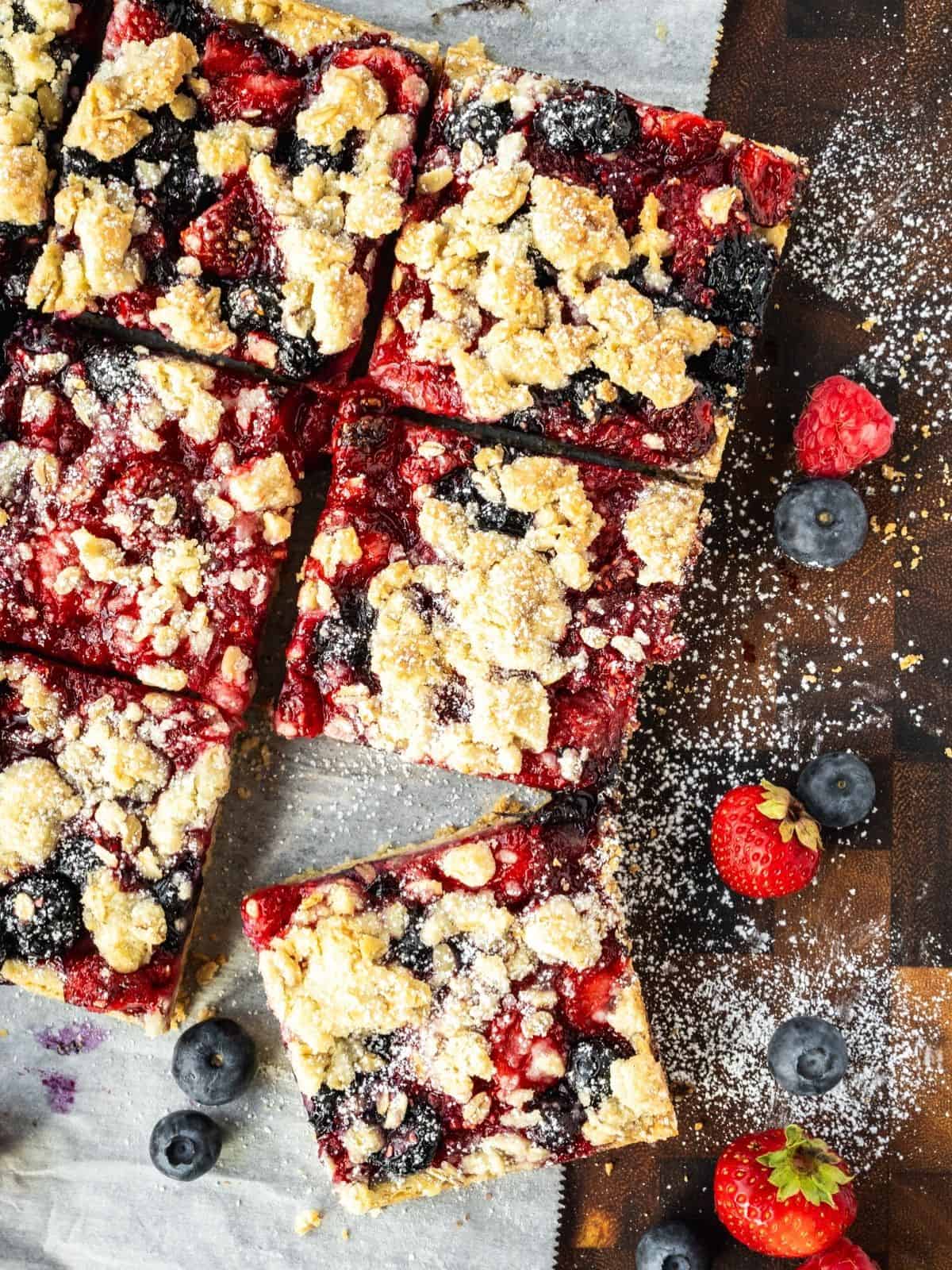 Delicious berry crumble bars with fresh berries and crumb topping.