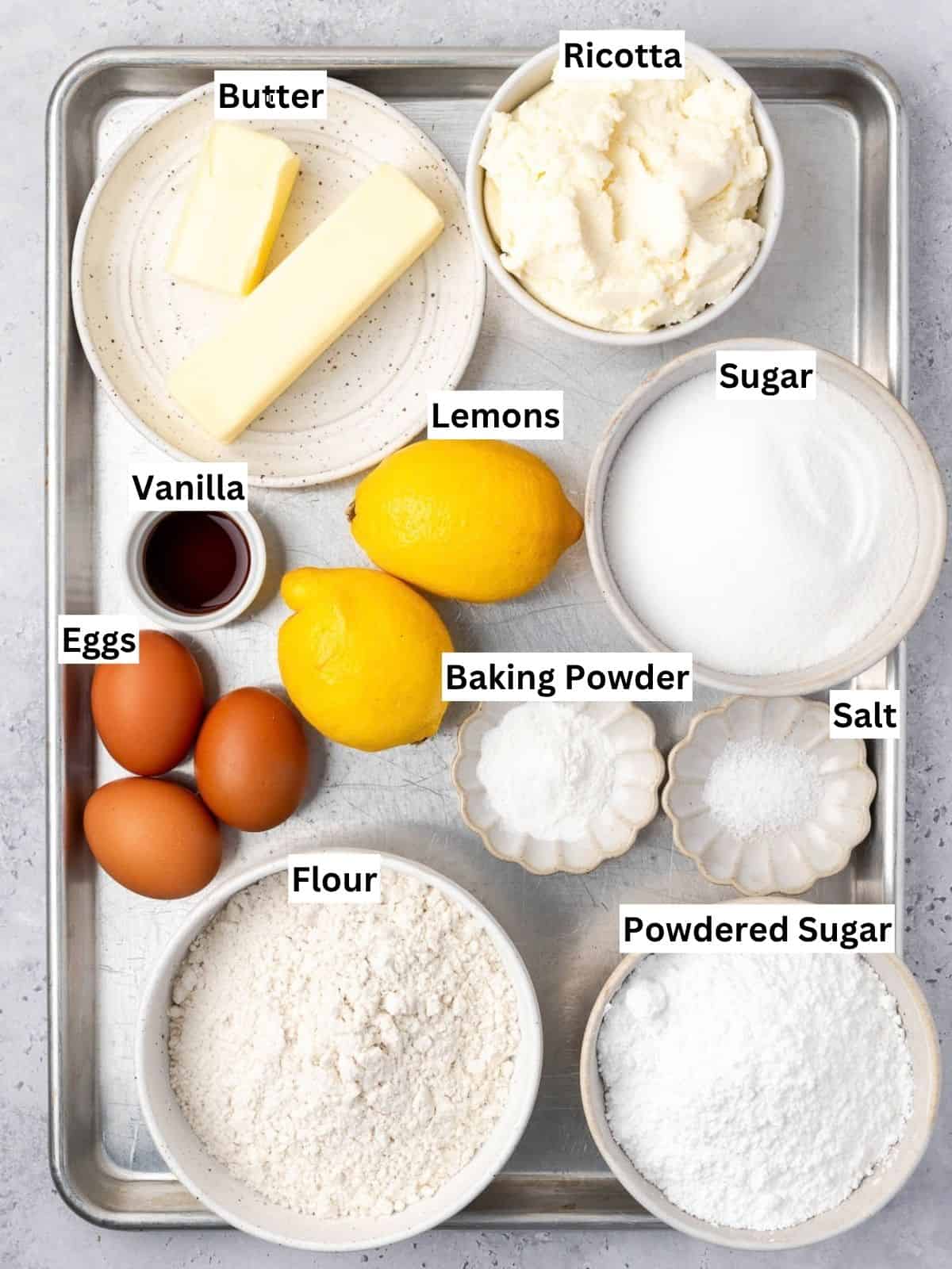 Lemon Ricotta Cake recipe ingredients with individual labels on a metal tray.