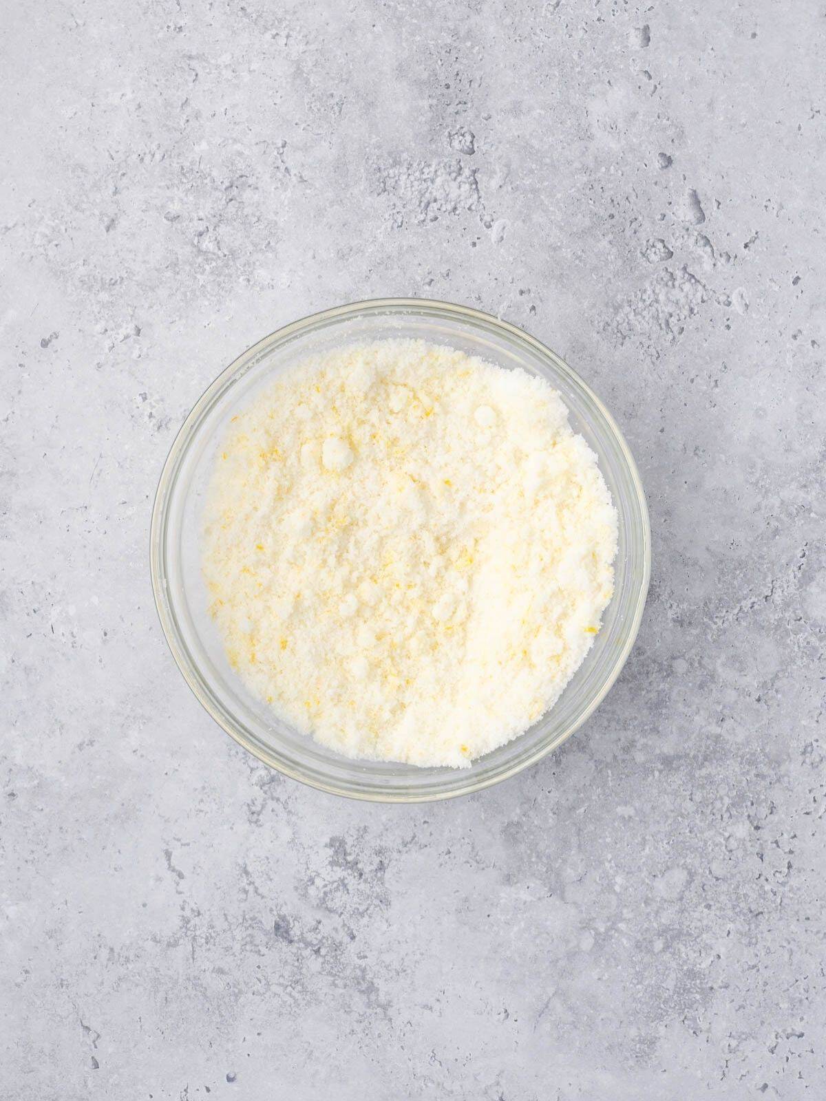Bowl with sugar and lemon zest.