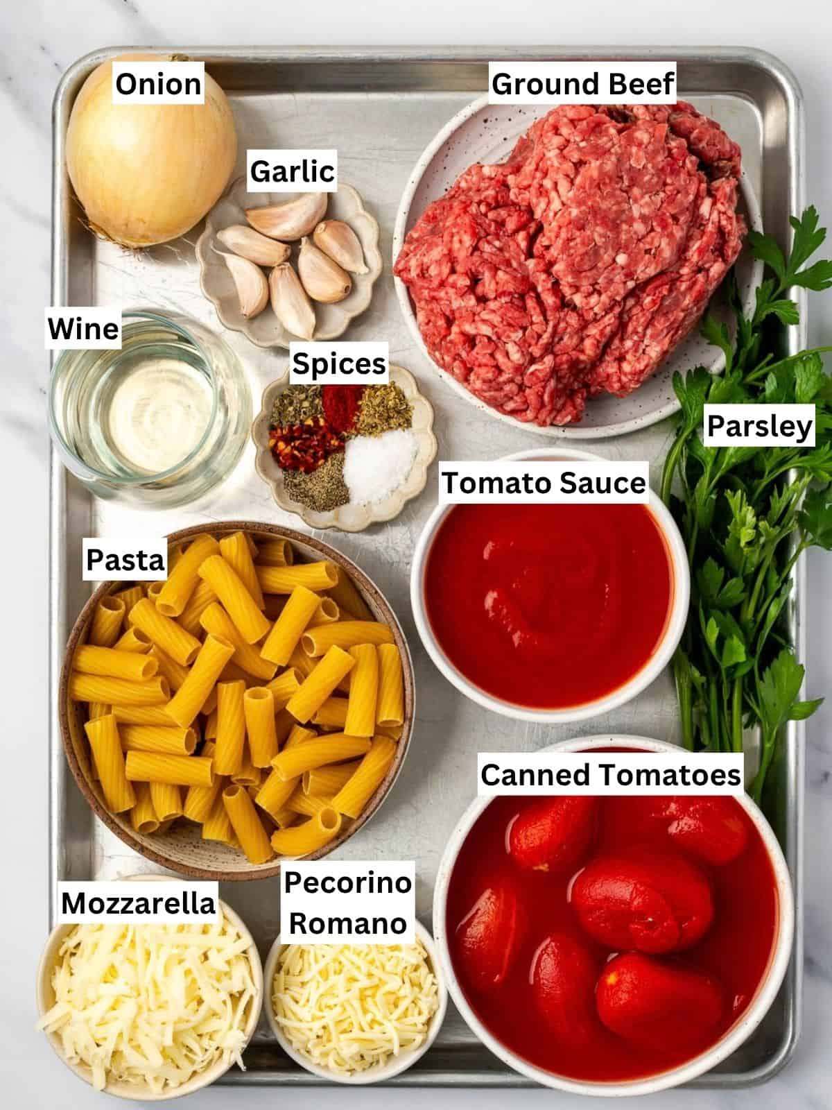 Pasta al Forno with Beef recipe ingredients with individual labels on a metal tray.