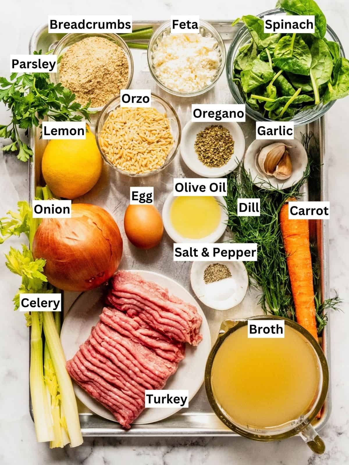 Turkey meatball orzo soup recipe ingredients with individual labels on a metal tray.