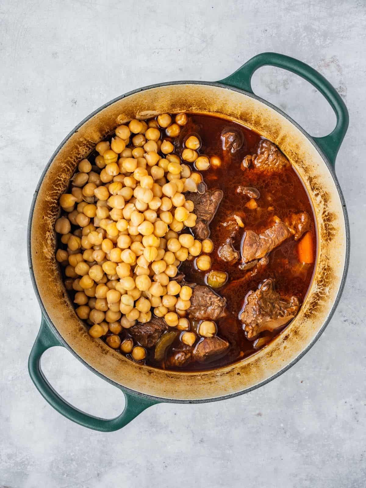 Chickpeas added to the cooked beef stew.