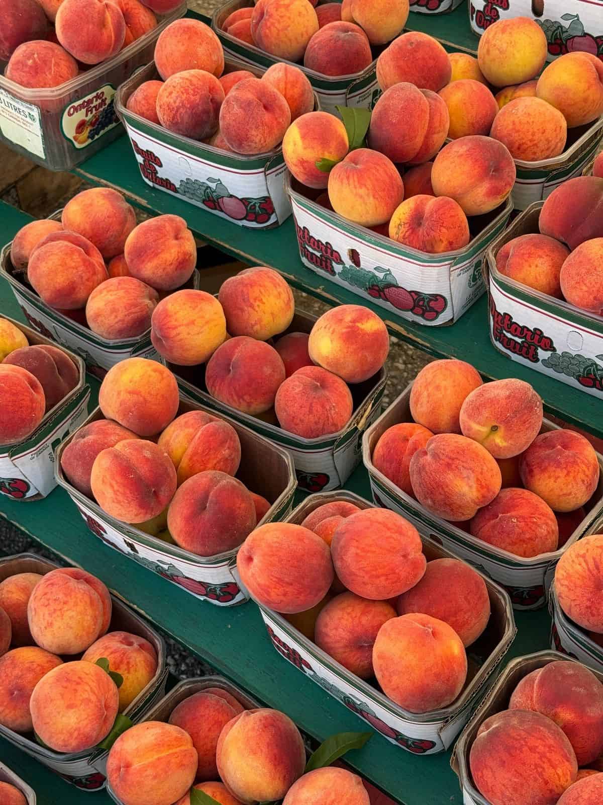 Peach baskets at a market stand.
